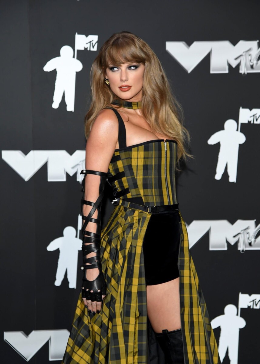 Fans are buzzing that Taylor Swift might announce Reputation TONIGHT after stunning in a yellow plaid corset dress at the 2024 MTV VMAs!